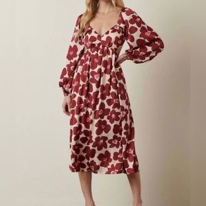 Boutique Midi Dress with side cutouts and open back details. Worn once.